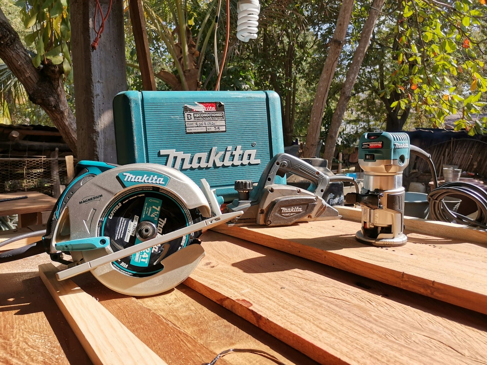 a table with a circular saw and a tool on it